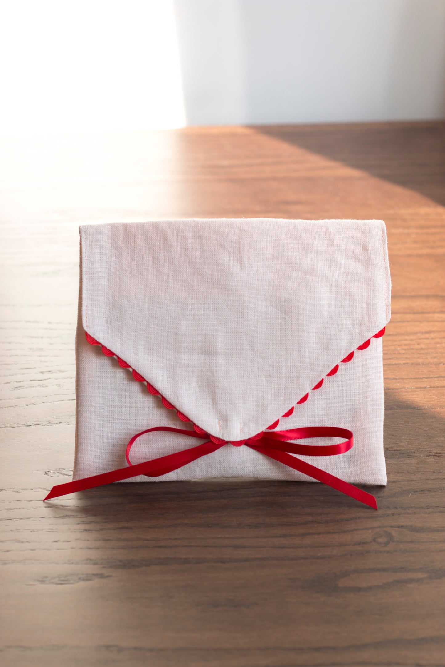 Pink linen envelope with red trim for Gifting